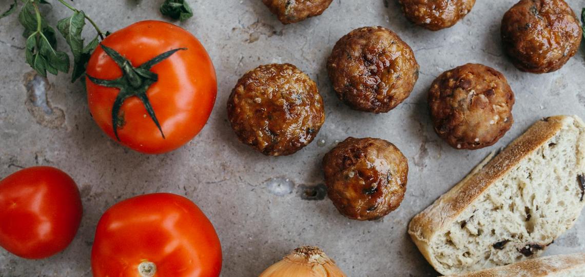 red tomatoes beside a sliced bread