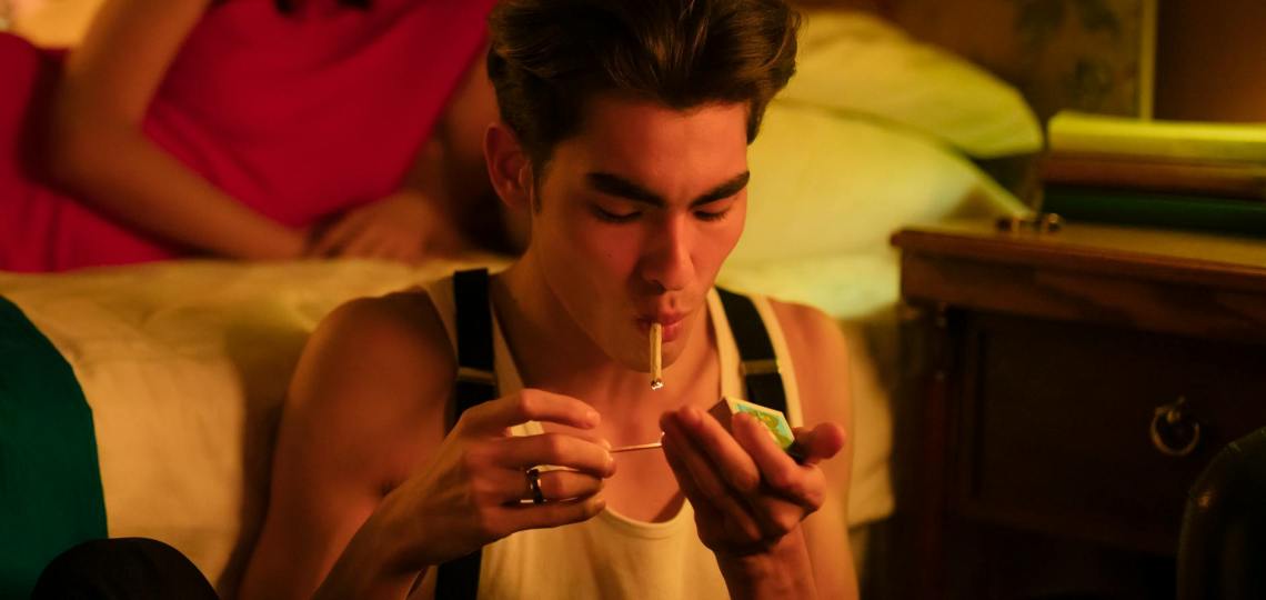 man smoking inside the room