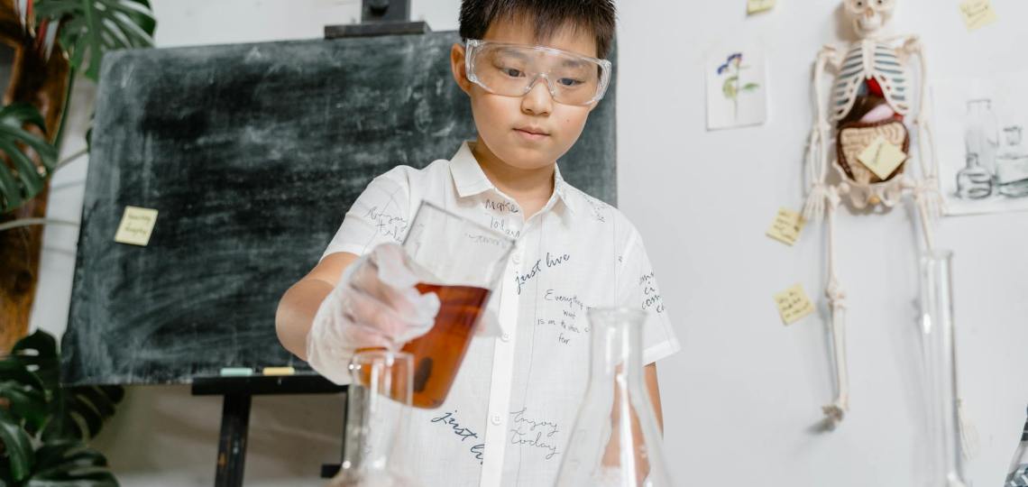 boy experimenting with colored liquids